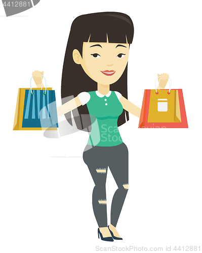 Image of Happy woman holding shopping bags.