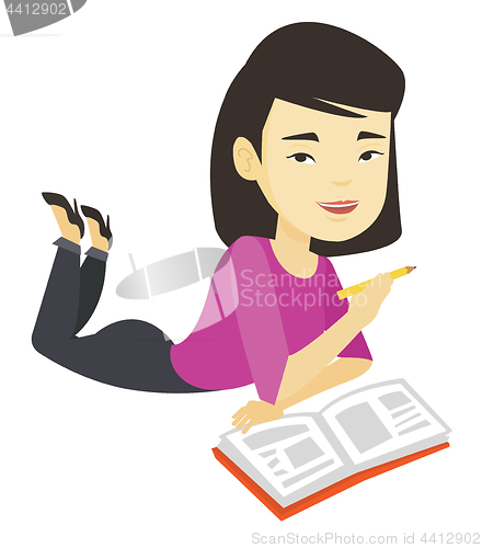 Image of Student laying on the floor and reading book.