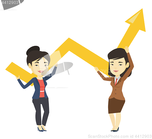 Image of Two business women holding growth graph.