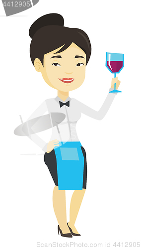 Image of Bartender holding a glass of wine in hand.