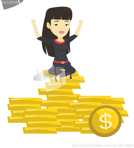 Image of Happy business woman sitting on golden coins.