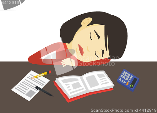 Image of Student sleeping at the desk with book.