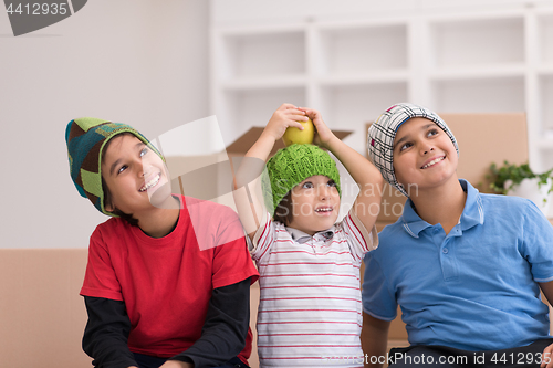 Image of boys with cardboard boxes around them