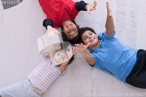 Image of young boys having fun on the floor