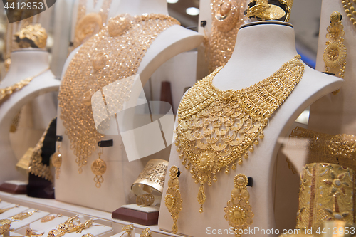 Image of gold jewelry in the shop window