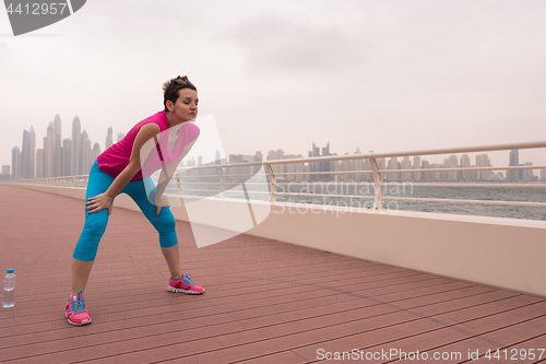 Image of woman stretching and warming up