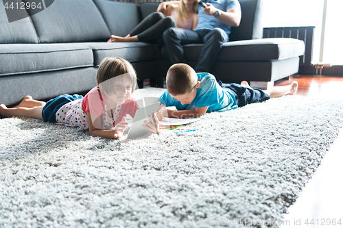 Image of young couple spending time with kids