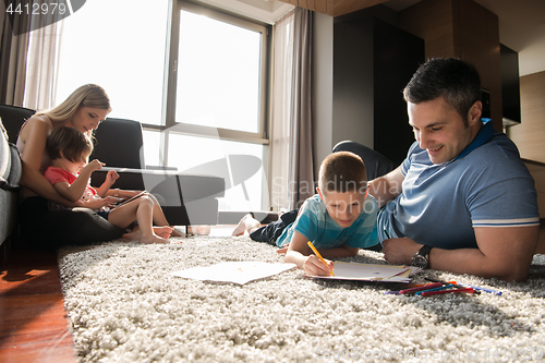 Image of young couple spending time with kids