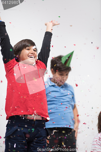 Image of kids  blowing confetti