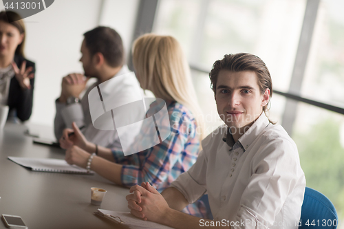 Image of Group of young people meeting in startup office