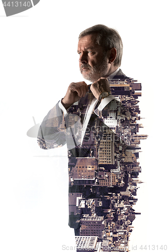 Image of Portrait of bearded businessman. Double exposure city on the background.