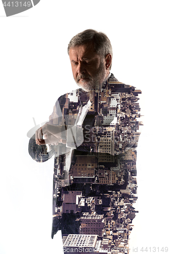 Image of Portrait of bearded businessman. Double exposure city on the background.