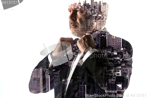 Image of Portrait of bearded businessman. Double exposure city on the background.