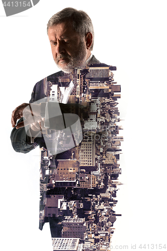 Image of Portrait of bearded businessman. Double exposure city on the background.