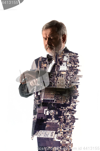 Image of Portrait of bearded businessman. Double exposure city on the background.