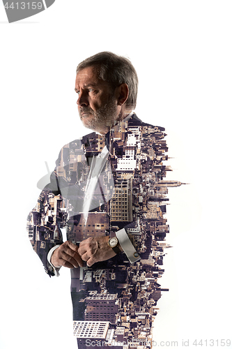 Image of Portrait of bearded businessman. Double exposure city on the background.