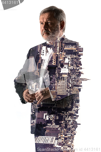 Image of Portrait of bearded businessman. Double exposure city on the background.