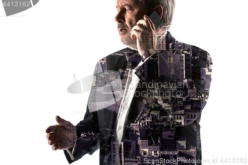 Image of Portrait of bearded businessman with phone. Double exposure city on the background.