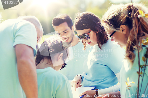 Image of group of volunteers planting trees in park