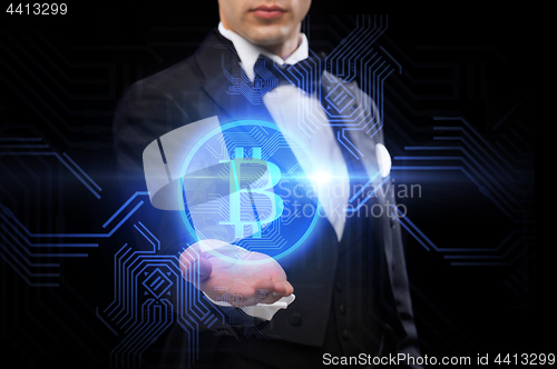 Image of close up of magician with bitcoin symbol