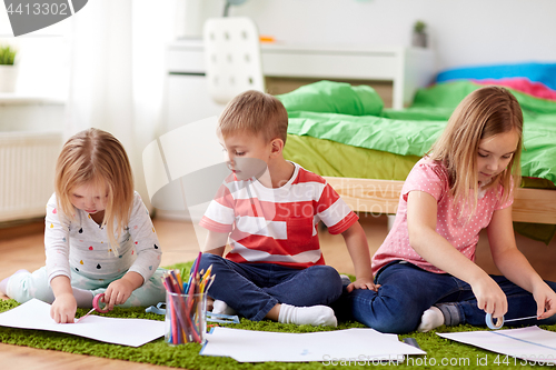 Image of happy kids drawing at home