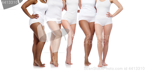 Image of group of happy diverse women in white underwear