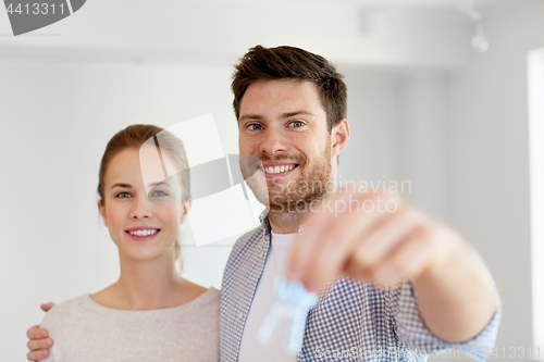 Image of happy couple with keys of new home