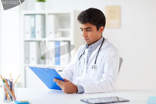 Image of doctor with clipboard at clinic