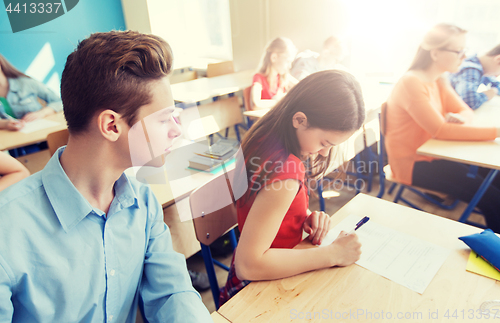 Image of group of students writing school test