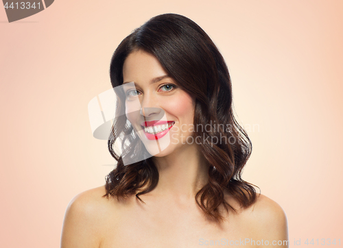 Image of beautiful smiling young woman with red lipstick