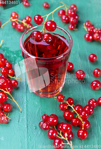 Image of Redcurrant and glass with fruits and drink juice