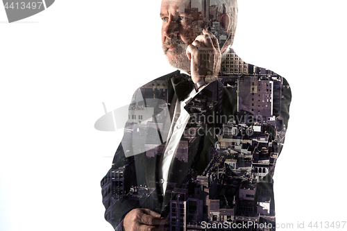 Image of Portrait of bearded businessman smiling. Double exposure city on the background.