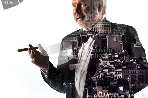 Image of Portrait of bearded businessman. Double exposure city on the background.