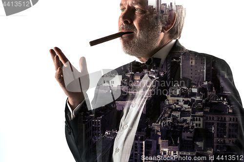 Image of Portrait of bearded businessman. Double exposure city on the background.