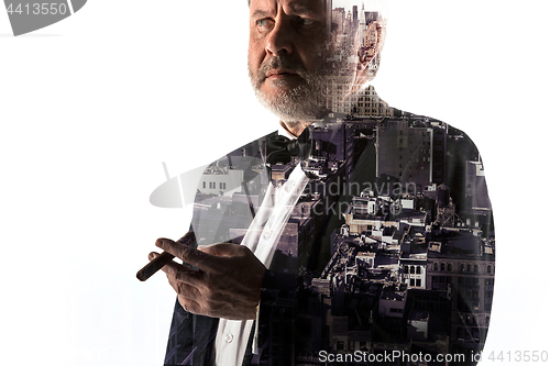 Image of Portrait of bearded businessman. Double exposure city on the background.