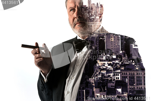 Image of Portrait of bearded businessman. Double exposure city on the background.