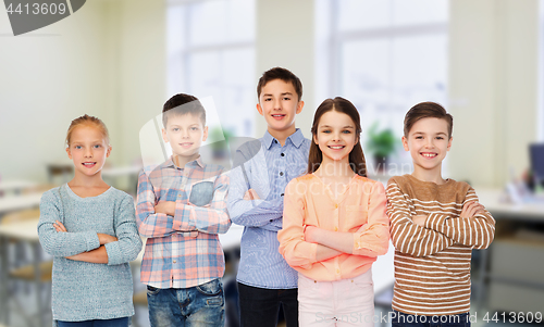 Image of happy students at school over classroom background