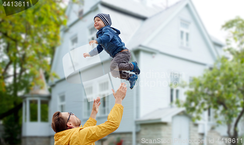 Image of father with son playing and having fun outdoors