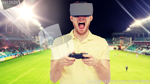 Image of man in virtual reality headset over football field