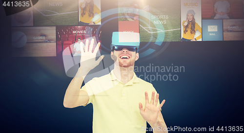 Image of happy man in virtual reality headset or 3d glasses