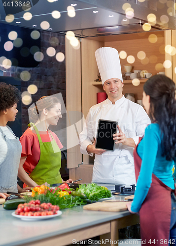 Image of happy women with chef and tablet pc in kitchen