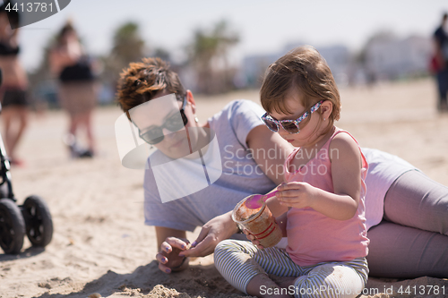 Image of Mom and daughter on the beach