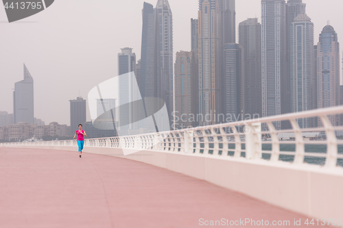 Image of woman running on the promenade