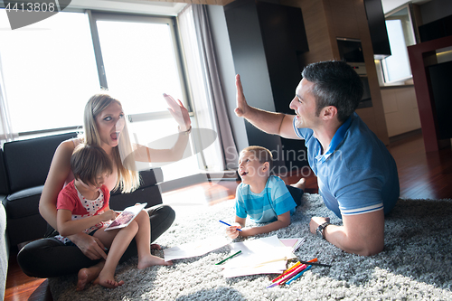 Image of young couple spending time with kids