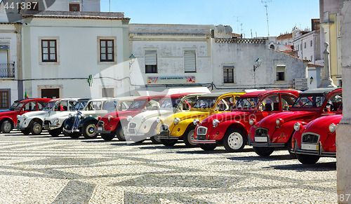 Image of Old and colored cars.