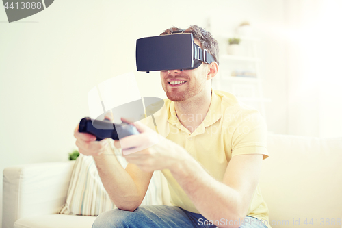 Image of man in virtual reality headset with controller