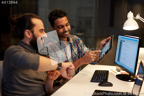 Image of creative team with tablet pc working at office