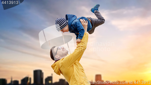 Image of father with son playing and having fun outdoors