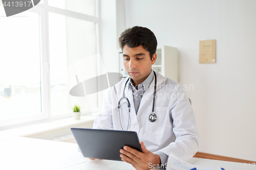 Image of doctor with tablet pc and stethoscope at clinic