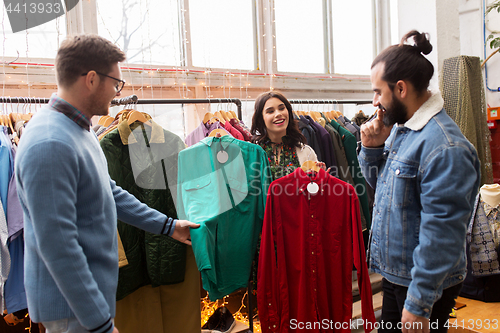 Image of friends choosing clothes at vintage clothing store